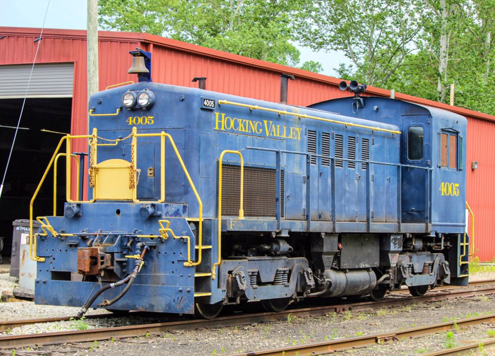 a train sitting on the side of a building